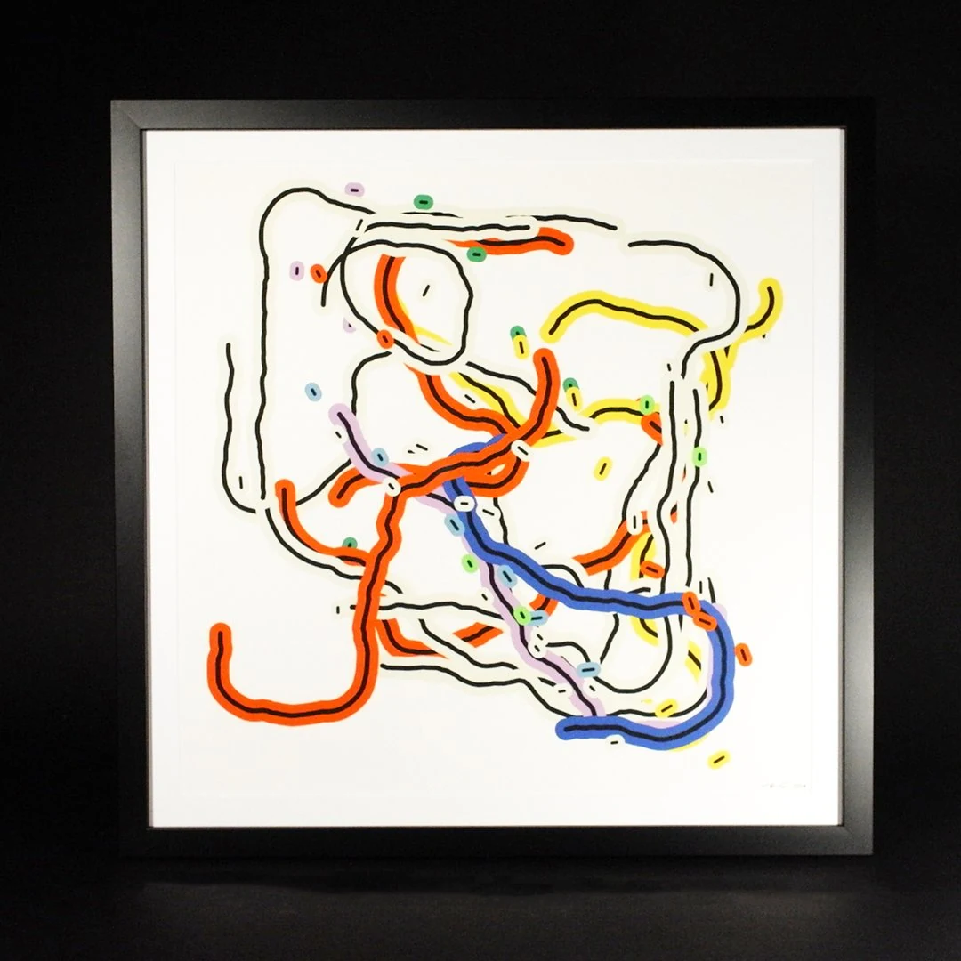 A framed print on a black background: wavering black lines inside bands of orange, blue, yellow, and lavender loop across a white sheet, scattered with small colored dashes.