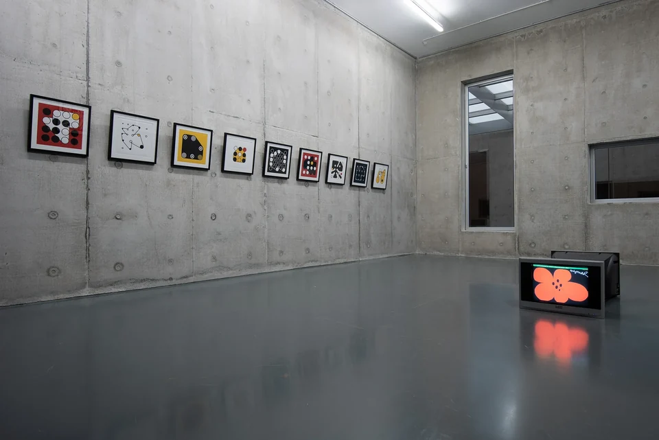 A row of framed Ringers prints displayed on a concrete wall at Le Freeport, Singapore.