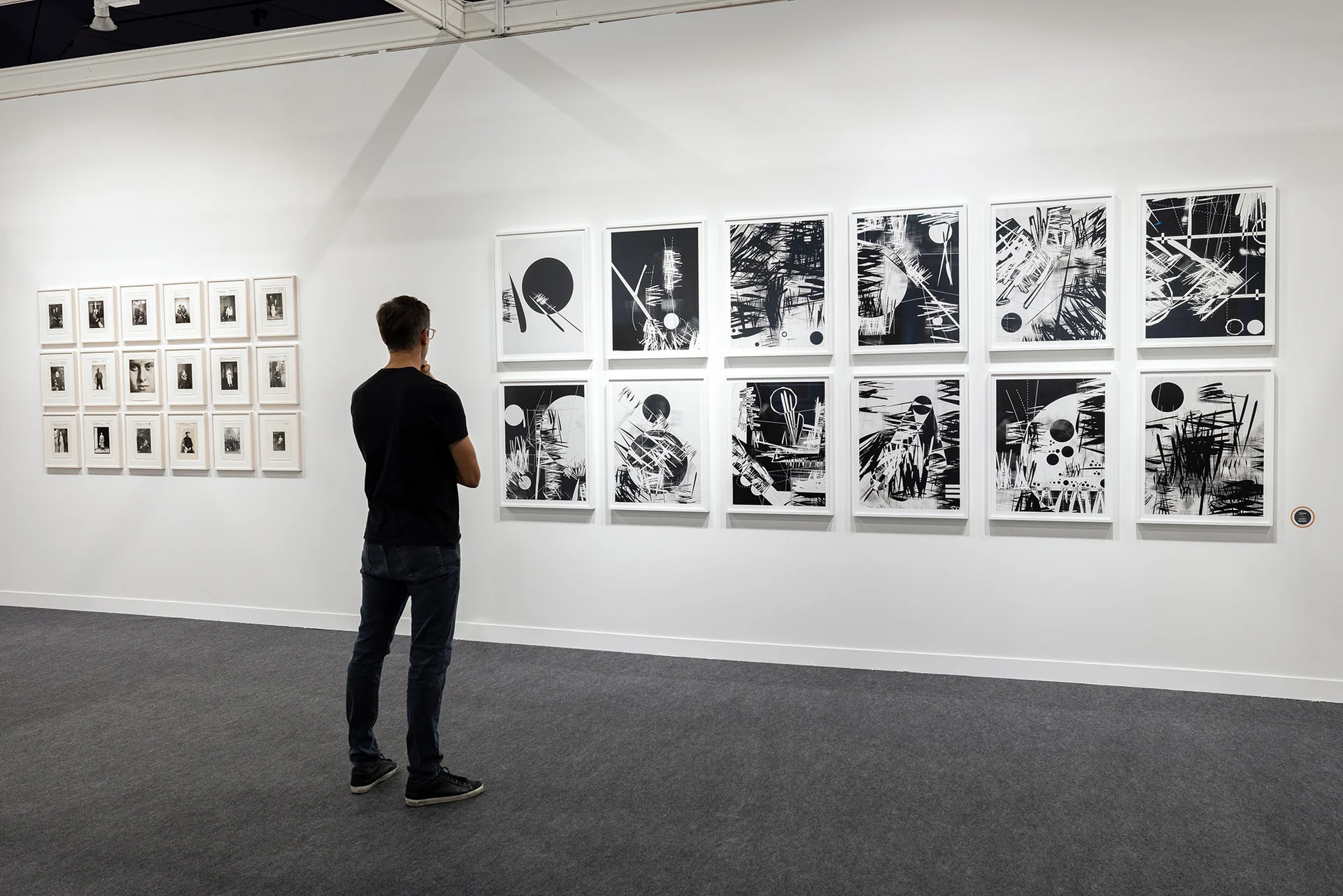 A visitor viewing the Light Years prints.