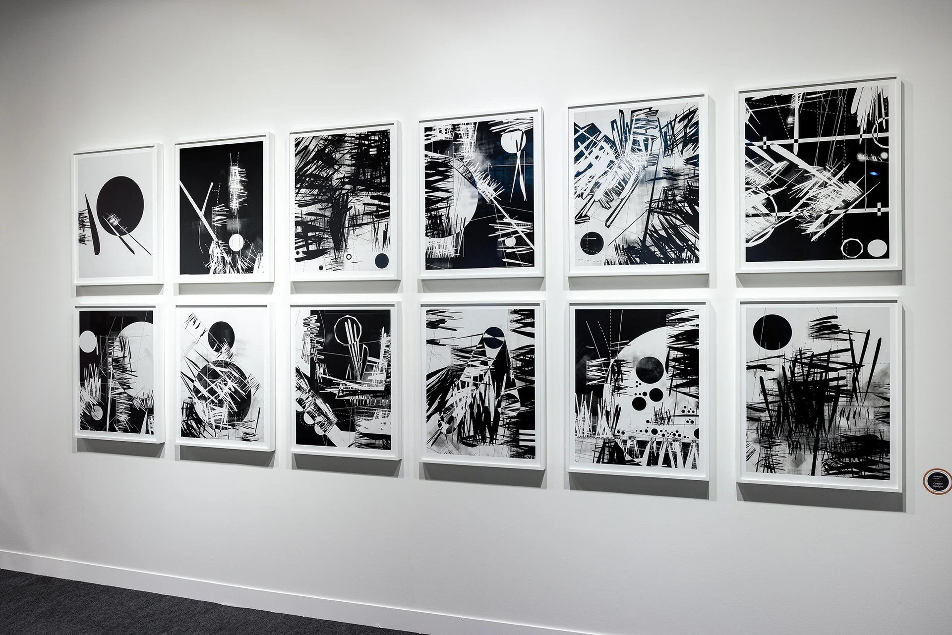 An angled view of the twelve gelatin silver prints.