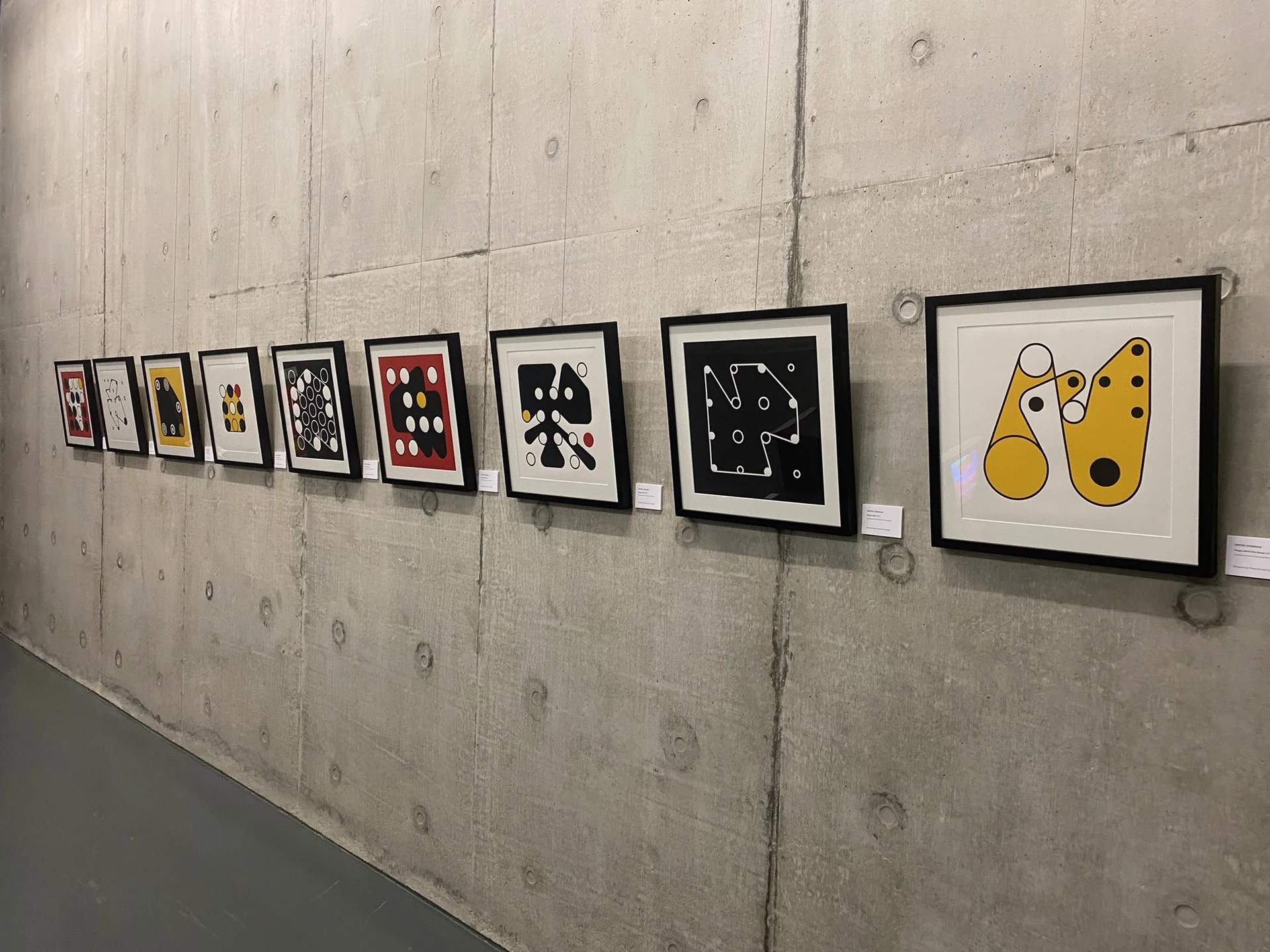 An angled view of the nine framed Ringers prints, with Ringers #180 in the foreground.