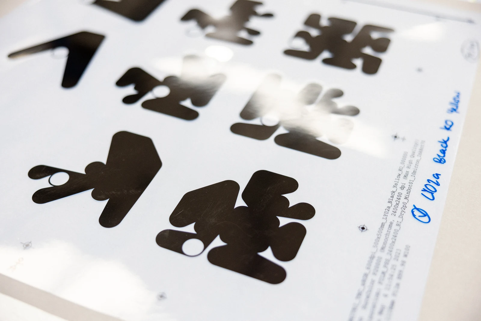 Black Ringers forms appear on a transparent film separation.