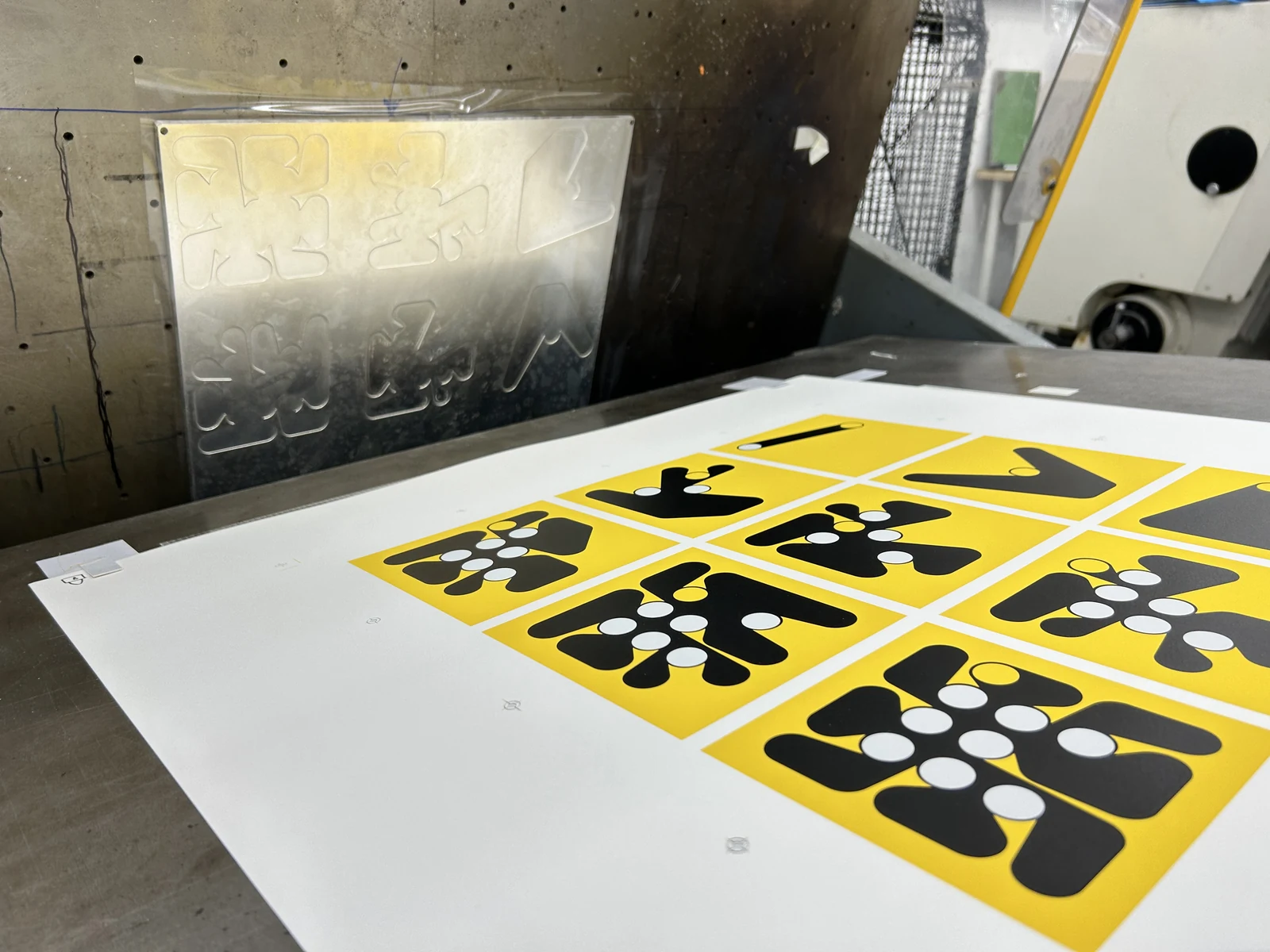 A close view of the printed Ringers grid beneath its metal embossing plate.