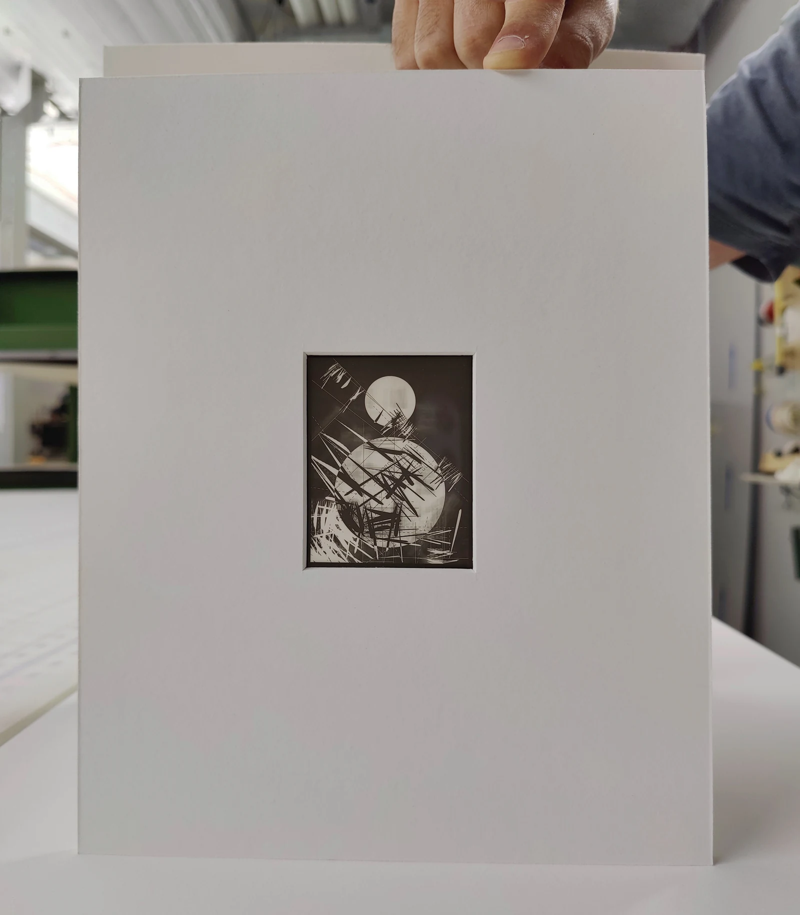 The photographic negative for Light Years #009 displayed in a large white mount, held upright in a studio.